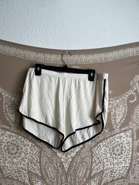 Naadam Cream Retro Dolphin-Hem Lounge Shorts with Black Trim